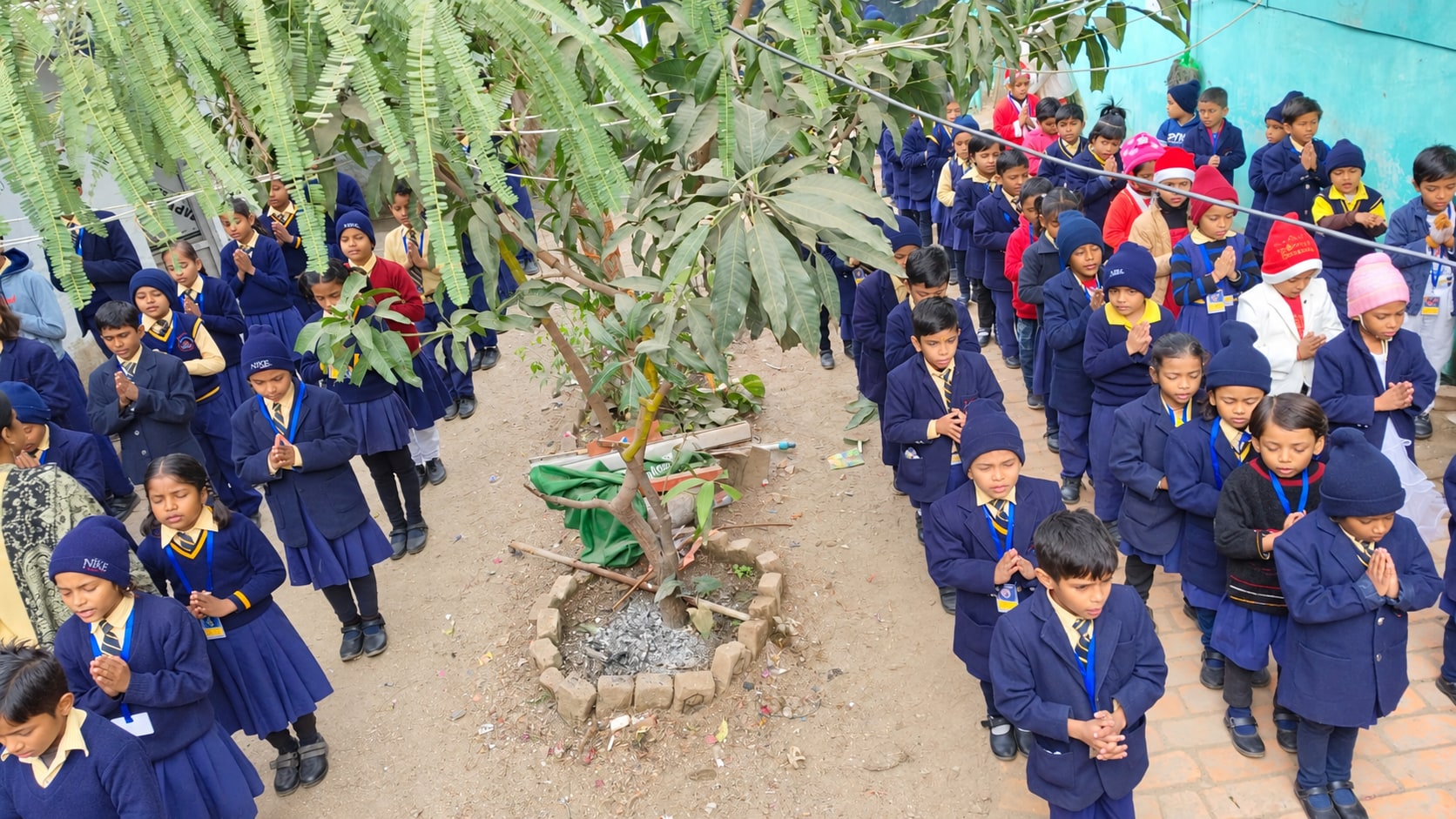 Kidee Wonders students gathering for morning assembly under the trees