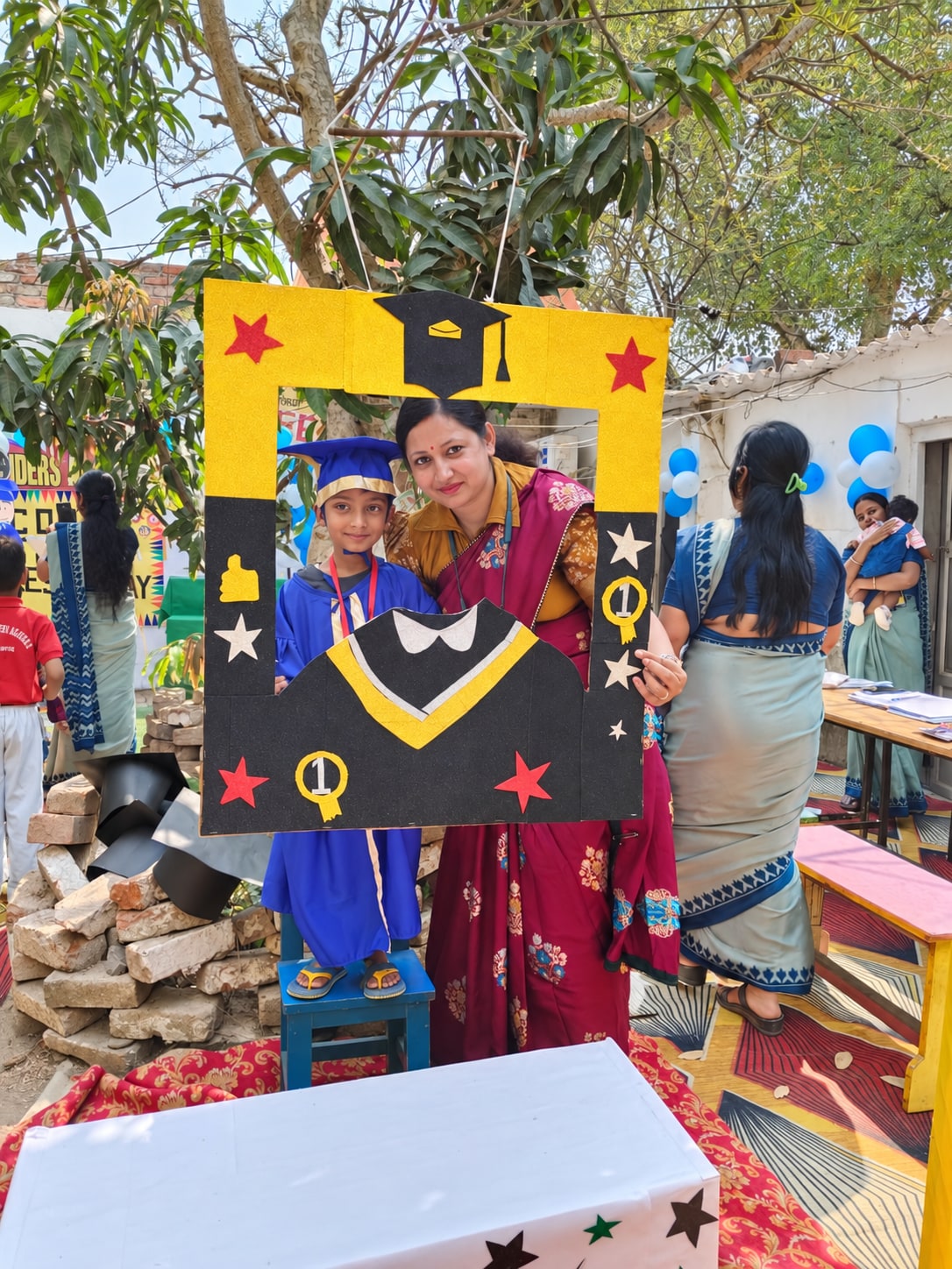 A child celebrating graduation with the school community