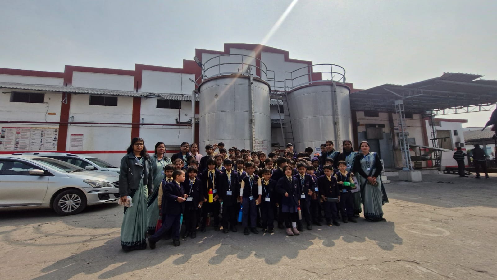 Students and teachers posing together on their picnic