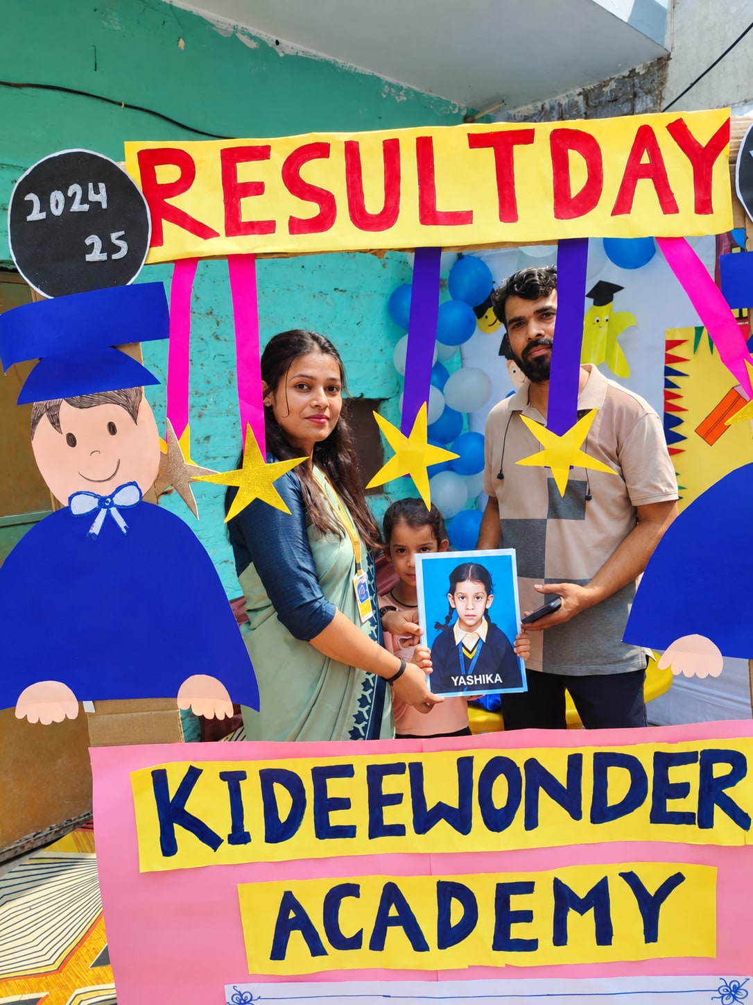 A family and teacher celebrating result day