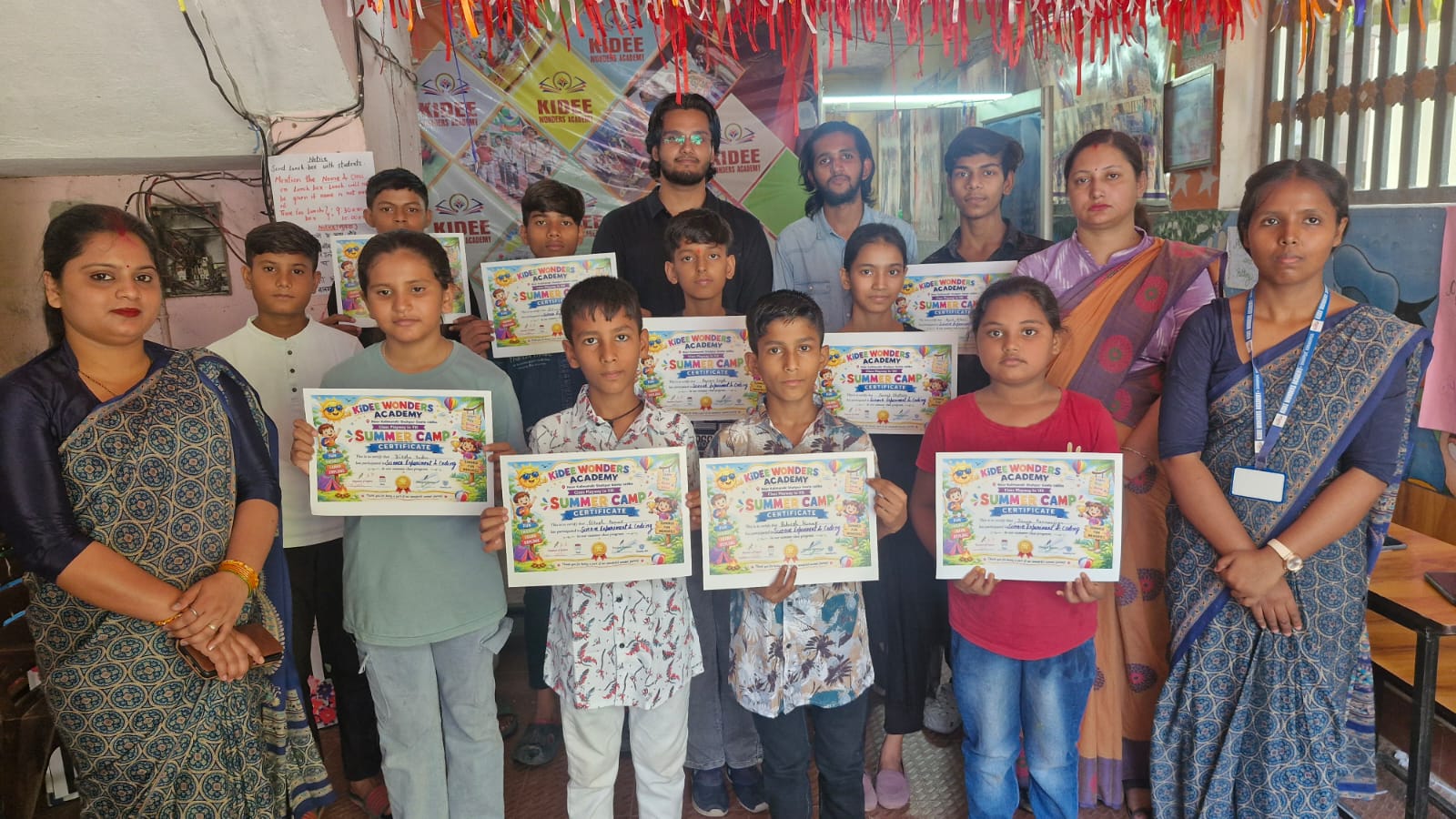 Students and teachers with summer camp certificates